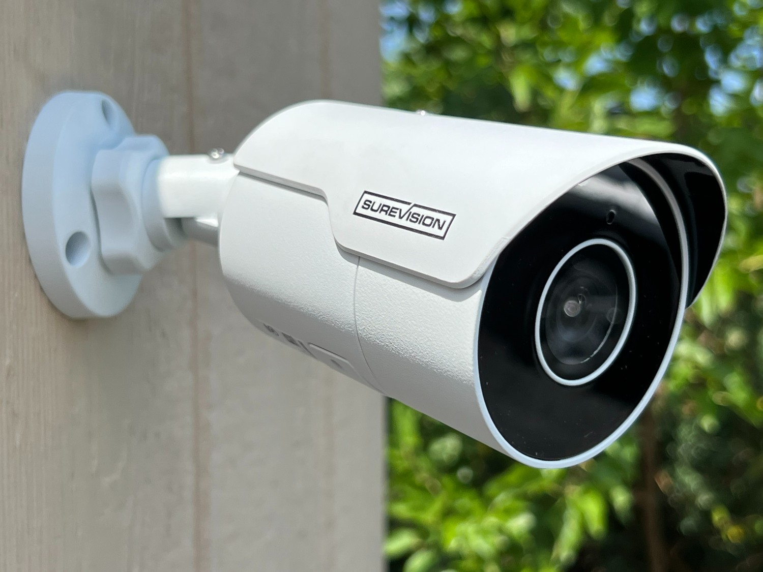Outdoor security camera mounted under a roof edge